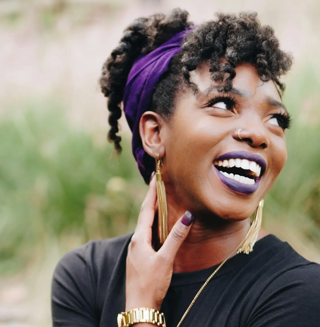 photo of woman wearing purple lipstick and black crew-neck shirt